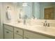 Bathroom featuring a double vanity with white countertops, under cabinet storage, and a large mirror at 1030 Grace Field Ave, Summerville, SC 29485