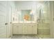Bright bathroom with double vanity, pendant lighting, and a marble shower with a glass door at 1030 Grace Field Ave, Summerville, SC 29485