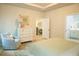 Tranquil bedroom with light-colored walls, area rug, dresser, and a view into the Primary bath at 1030 Grace Field Ave, Summerville, SC 29485