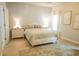 Comfortable bedroom with neutral decor, area rug, bedside tables, and lamps at 1030 Grace Field Ave, Summerville, SC 29485