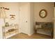 Cozy entryway boasts a wooden bench, decorative mirror, coat hooks, and a console table with drawers at 1030 Grace Field Ave, Summerville, SC 29485