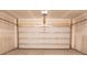 Clean garage with white garage door, ready for vehicle and storage, and overhead lighting at 1030 Grace Field Ave, Summerville, SC 29485