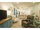 Inviting living room with hardwood floors, comfortable seating, and open floor plan leading to the dining area and kitchen at 1030 Grace Field Ave, Summerville, SC 29485