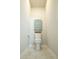 Compact powder room with unique tile floors and a decorative toilet paper holder at 1030 Grace Field Ave, Summerville, SC 29485