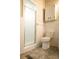Bathroom featuring tile flooring, a toilet, and a glass enclosed shower at 1044 Academy Rd, Walterboro, SC 29488