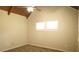 Bedroom featuring high ceilings, a ceiling fan, two bright windows, and carpet at 1044 Academy Rd, Walterboro, SC 29488