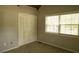 Bedroom featuring high wood ceilings, carpet, a window, and a closet at 1044 Academy Rd, Walterboro, SC 29488