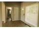 Entryway with hardwood floors, a window, and a white front door at 1044 Academy Rd, Walterboro, SC 29488