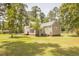 View of the house with a spacious backyard, showcasing the home's attractive exterior and setting at 1044 Academy Rd, Walterboro, SC 29488