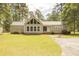 Charming one-story home with a manicured lawn and mature trees, featuring a metal roof at 1044 Academy Rd, Walterboro, SC 29488