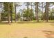 Charming home with a spacious front yard surrounded by mature trees, offering a peaceful setting at 1044 Academy Rd, Walterboro, SC 29488