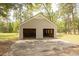 Large, detached two-car garage with ample space for vehicles and storage at 1044 Academy Rd, Walterboro, SC 29488