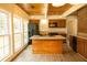 Sun-lit kitchen features an island, wood cabinetry, and modern appliances with large windows at 1044 Academy Rd, Walterboro, SC 29488