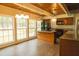 Bright kitchen boasting an island, wood cabinets, and ample natural light from large windows at 1044 Academy Rd, Walterboro, SC 29488