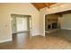 Spacious living room with wood-look floors and a brick fireplace, offering a cozy atmosphere at 1044 Academy Rd, Walterboro, SC 29488