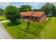 Aerial view showcasing a brick home with a well-maintained lawn and charming curb appeal, nestled in a serene neighborhood at 107 Salina Ln, Goose Creek, SC 29445