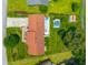 Bird's eye view featuring a brick house with a pool, large backyard, and surrounding greenery, providing a private oasis at 107 Salina Ln, Goose Creek, SC 29445