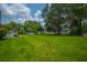 Expansive backyard featuring lush green grass, a charming gazebo, and a refreshing pool area, perfect for outdoor relaxation at 107 Salina Ln, Goose Creek, SC 29445