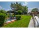 Backyard featuring a gazebo, patio, green grass, mature trees, and well-maintained landscaping at 107 Salina Ln, Goose Creek, SC 29445