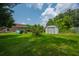 Well-kept backyard with a storage shed, gazebo, and plenty of green space, creating a serene outdoor environment at 107 Salina Ln, Goose Creek, SC 29445