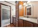 Bathroom featuring double sink, granite countertops, and a shower-tub with a glass door at 107 Salina Ln, Goose Creek, SC 29445