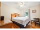 Traditional bedroom boasts hardwood floors, a comfortable bed, and natural light from a large window at 107 Salina Ln, Goose Creek, SC 29445
