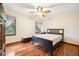 Classic bedroom featuring hardwood floors, complemented by a ceiling fan, and comfortable sleeping quarters at 107 Salina Ln, Goose Creek, SC 29445