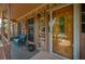 Charming front porch with a decorative front door, brick accents, and cozy seating, welcoming visitors with curb appeal at 107 Salina Ln, Goose Creek, SC 29445