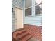Charming back entrance with brick steps and blue siding at 111 Long Bow Rd, Summerville, SC 29485