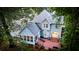 Aerial view of the back of the home with brick patio, stairs, and lush yard at 111 Long Bow Rd, Summerville, SC 29485
