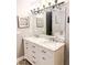 Bathroom with a double vanity, marble countertop, decorative mirrors and lighting at 111 Long Bow Rd, Summerville, SC 29485