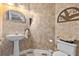Powder room features decorative wallpaper, a pedestal sink, and classic fixtures at 111 Long Bow Rd, Summerville, SC 29485