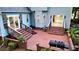 Wide shot of the brick patio with stairs and railings leading up to the back doors at 111 Long Bow Rd, Summerville, SC 29485