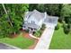 Aerial view of the home with charming front porch, two-car garage and manicured lawn at 111 Long Bow Rd, Summerville, SC 29485