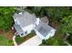Aerial view of the home with charming front porch, two-car garage and manicured lawn at 111 Long Bow Rd, Summerville, SC 29485