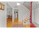 Bright foyer showcases hardwood floors, staircase, and decorative rug creating a welcoming entrance at 111 Long Bow Rd, Summerville, SC 29485