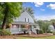 Charming covered front porch features white railings and steps, offering a relaxing outdoor space at 111 Long Bow Rd, Summerville, SC 29485