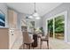 Eat-in kitchen featuring a breakfast nook with elegant round table and backyard views at 111 Long Bow Rd, Summerville, SC 29485