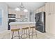 Bright kitchen features an island with seating, modern appliances, and ample cabinet space at 111 Long Bow Rd, Summerville, SC 29485