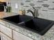Stylish kitchen sink with granite countertops and a modern faucet at 111 Long Bow Rd, Summerville, SC 29485