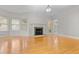 Spacious living room boasts hardwood floors, fireplace, and ample natural light creating an inviting atmosphere at 111 Long Bow Rd, Summerville, SC 29485