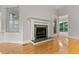 Bright living room features hardwood floors and a green marble fireplace at 111 Long Bow Rd, Summerville, SC 29485