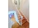Bright staircase leads to the upper level with hardwood steps and white risers at 111 Long Bow Rd, Summerville, SC 29485
