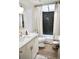 Bathroom featuring shower, vanity, mirror, dark green tile, and neutral walls at 1119 Morning Glory Ct, Mount Pleasant, SC 29464