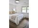 Cozy bedroom featuring a comfortable bed and neutral furnishings, with hardwood flooring at 1119 Morning Glory Ct, Mount Pleasant, SC 29464