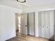 Bedroom featuring hardwood floors, bifold closet doors, and neutral walls at 1119 Morning Glory Ct, Mount Pleasant, SC 29464