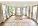 Sunlit dining room features light wood floors, neutral walls, and a modern circular table at 1119 Morning Glory Ct, Mount Pleasant, SC 29464