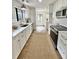 Modern kitchen featuring white cabinets, stainless steel appliances, and butcher block countertops at 1119 Morning Glory Ct, Mount Pleasant, SC 29464