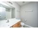 Bathroom with tile floors, toilet, vanity, mirror and bar lighting at 113 Lebsl Ct, Summerville, SC 29483