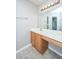 Vanity in bathroom with wooden cabinets, a light bar and a mirror at 113 Lebsl Ct, Summerville, SC 29483